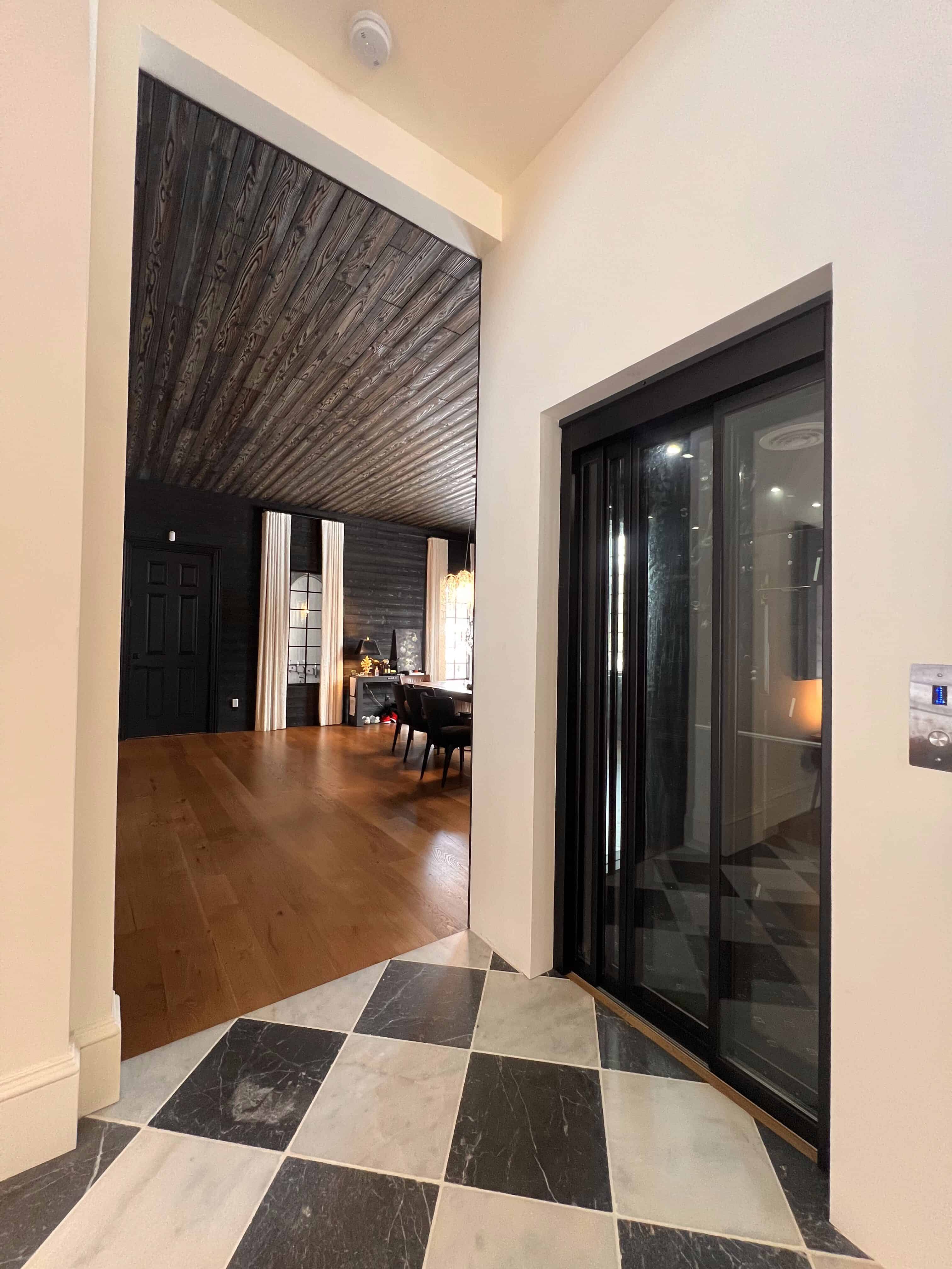 Glass private residential elevator in a modern home